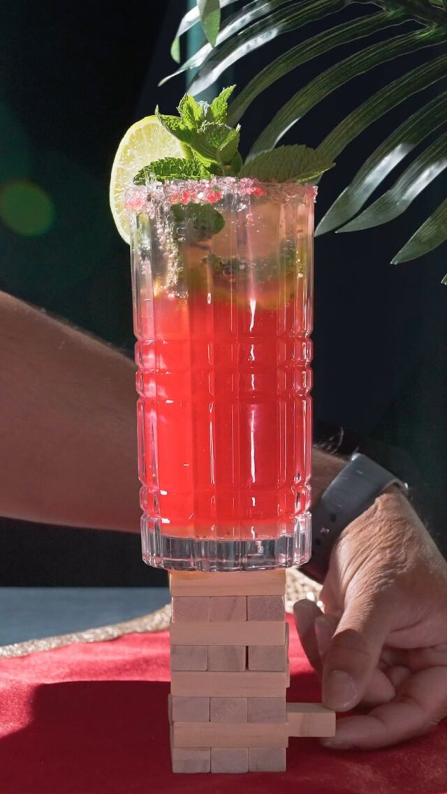 Elevate your sip game! 🍓✨ Check out our Strawberry Mojito balancing on Jenga—where flavour meets fun. 🎉 #spicevillage #mojitomagic #stackedandstyled